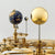 Hermle Tellurium Tourbillon 23069 • Tourbillon bañado en oro • Telurio con fase lunar