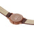 Reloj unisex Mondaine con correa de cuero marrón; parte trasera de la caja impresa.