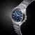 Reloj de hombre con correa de acero inoxidable y esfera azul, caja redonda con índices