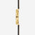 Silla de montar Naos Edition Heritage, color marrón oscuro y dorado, con brida negra, vista de perfil en gris.