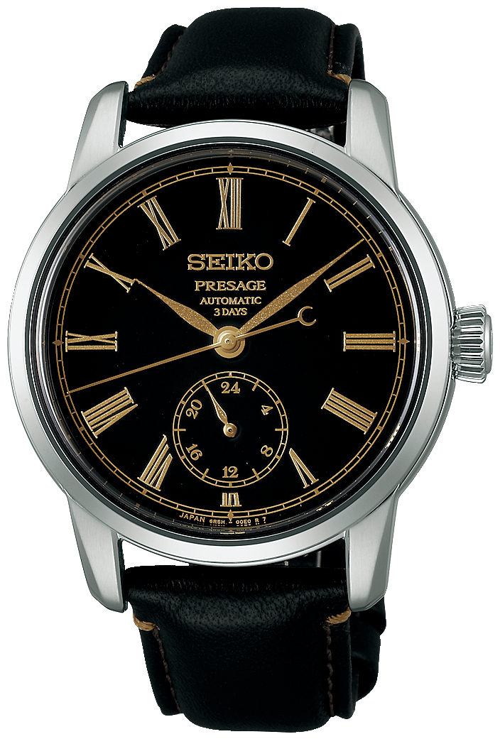 Reloj de hombre con esfera negra, índices dorados y correa de cuero