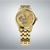 Reloj dorado para hombre con correa de metal, esfera dorada y movimiento automático visible
