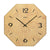 Reloj de pared con esfera dorada, números negros y logo de AMS