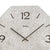 Reloj de pared con esfera octogonal gris claro, números grandes, logotipo AMS y manecillas negras