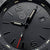 Detalle de la esfera Luminox: logo, índices y grabado "200 METERS"; superficie negra.