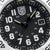 Luminox dial with black scale, silver markers, gold hands, date