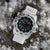 Reloj Luminox para hombre con correa blanca, esfera negra e índices luminosos verdes