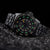 Pulsera de hombre, vista lateral: esfera negra con marcadores luminosos verdes