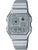 Reloj Casio Vintage con correa de metal plateada y pantalla digital, detalles en azul