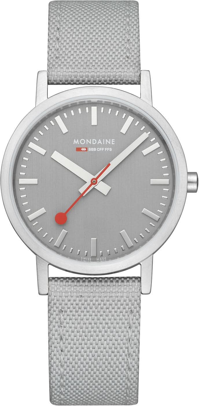 Reloj unisex con correa textil gris, caja plateada y esfera gris.