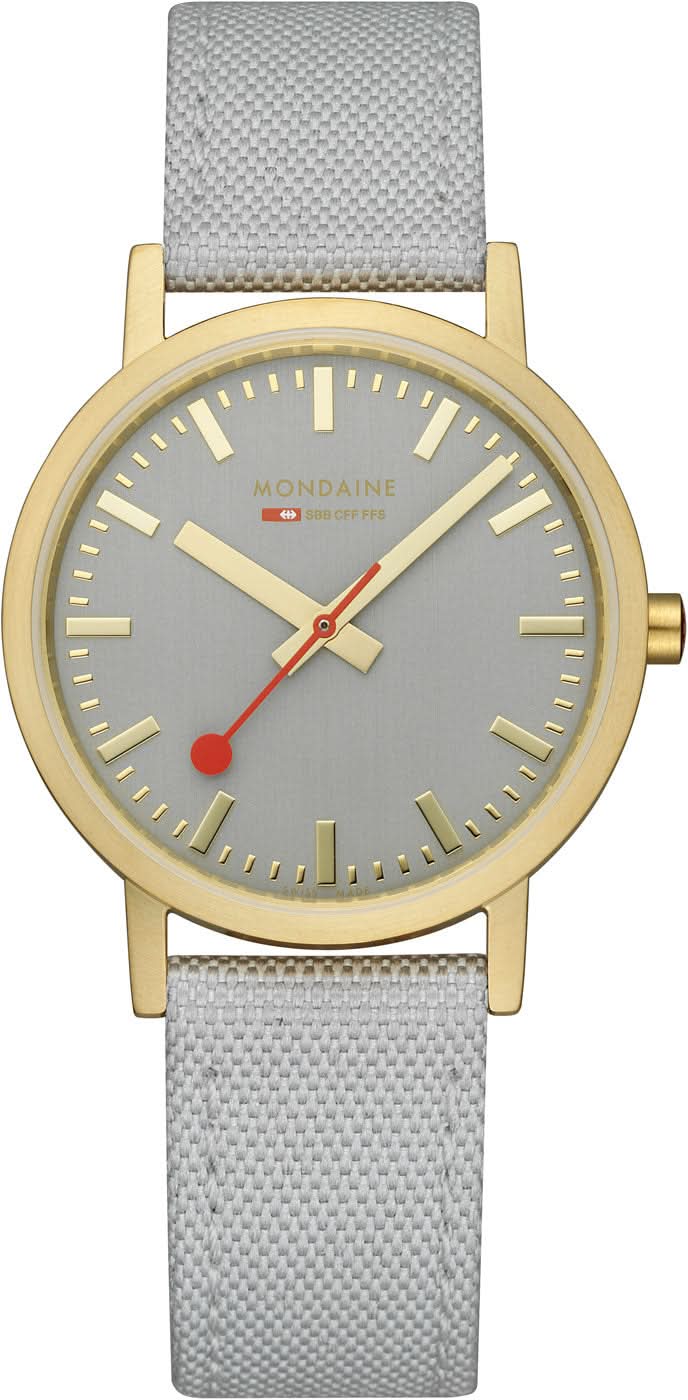 Reloj Mondaine unisex con correa textil gris, bisel dorado y esfera gris