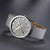 Reloj unisex con correa textil gris y esfera gris, segundero rojo