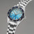 Reloj de hombre con brazalete de acero inoxidable, esfera azul con marcadores luminosos y fecha