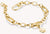 Pulsera de eslabones chapada en oro con eslabones ovalados y charm de flor en el borde