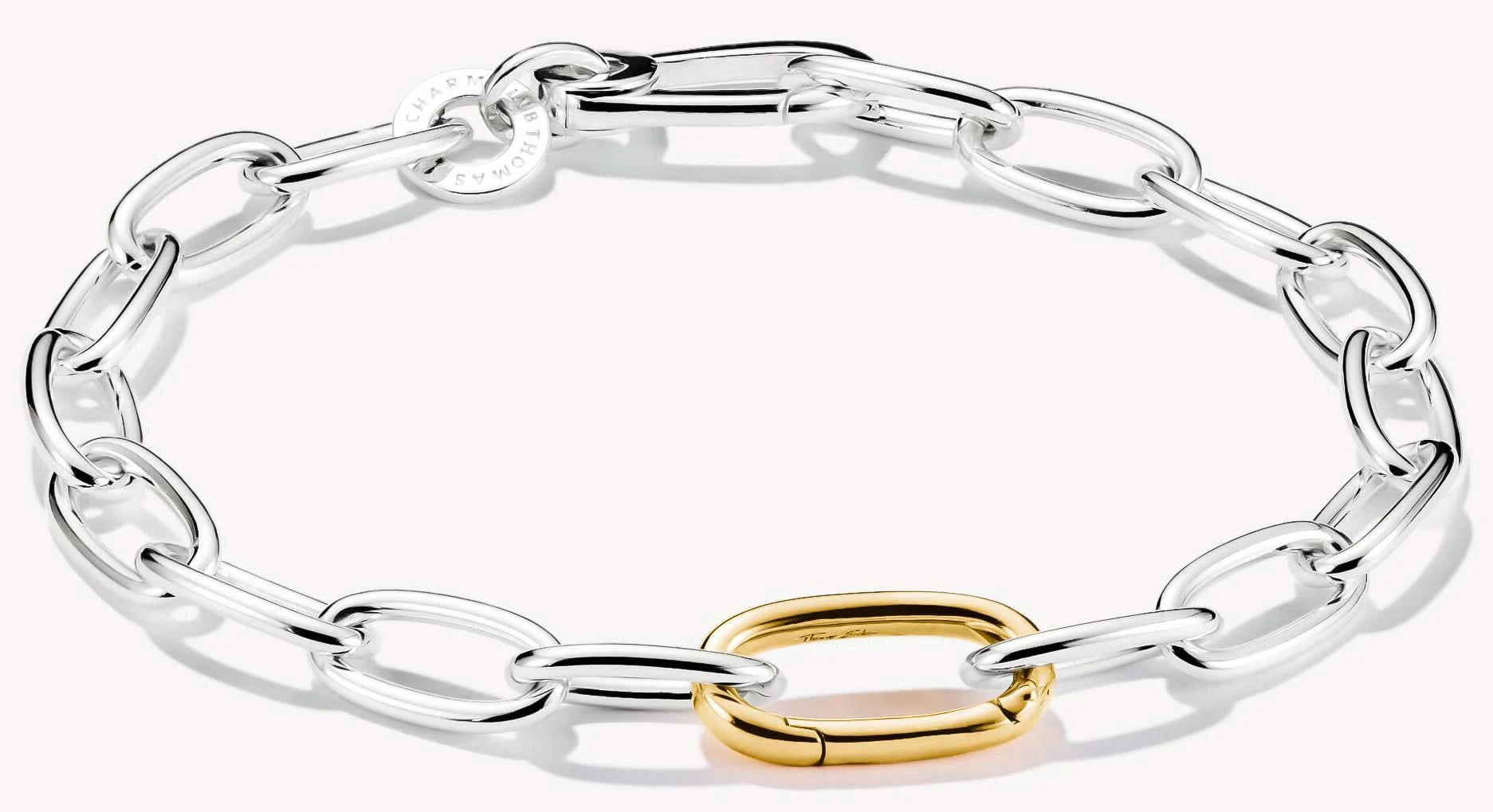 Pulsera de eslabones con eslabones plateados y eslabón conector dorado, Thomas Sabo