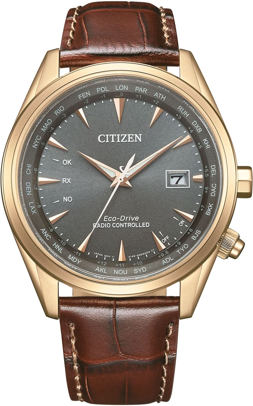 Reloj de hombre con correa de cuero marrón, bisel dorado y esfera oscura, ventana de fecha