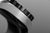Pulsera de hombre vista lateral: bisel negro con marcadores plateados