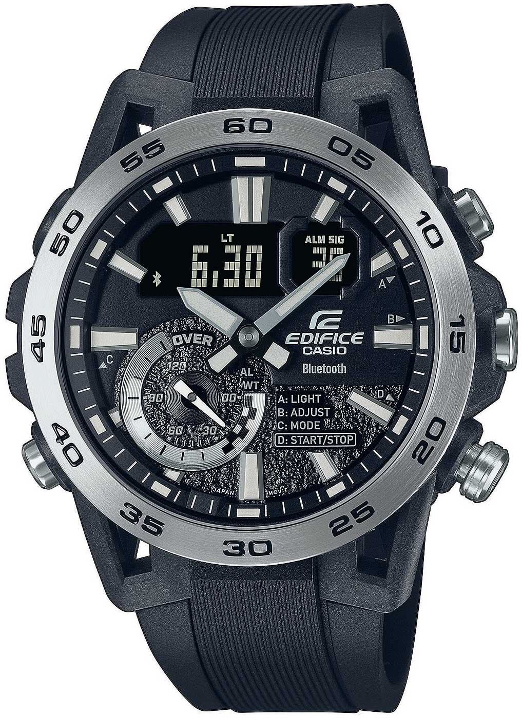 Reloj deportivo con esfera negra, pantalla digital, correa de silicona negra e índices luminosos
