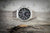 Pulsera de acero inoxidable plateado para hombre con esfera negra de cronógrafo