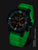 Reloj de hombre con esfera verde luminosa y caja oscura, correa de silicona
