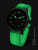 Pulsera de hombre con caja negra, índices luminiscentes verdes y correa de caucho negra