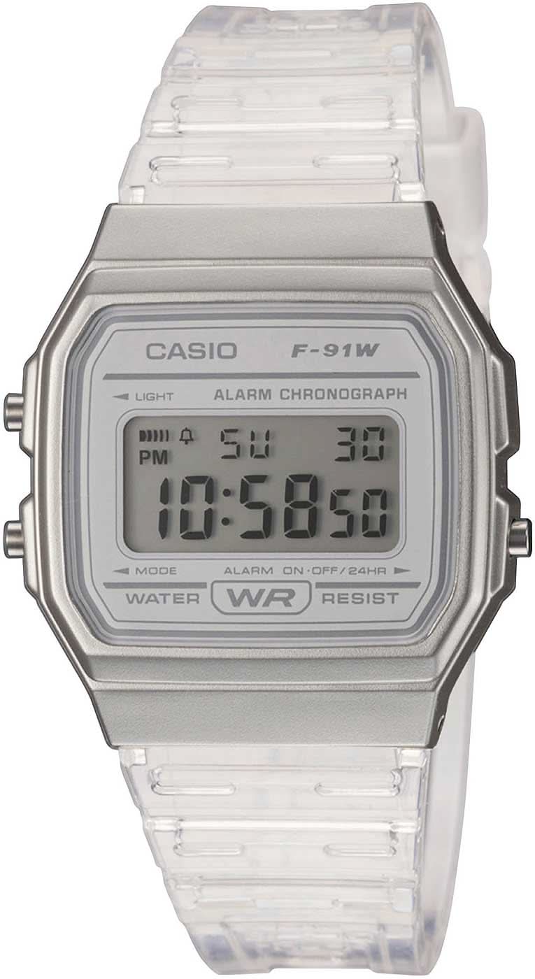 Reloj Casio para mujer con pantalla LCD digital, caja plateada y pulsera de plástico transparente.