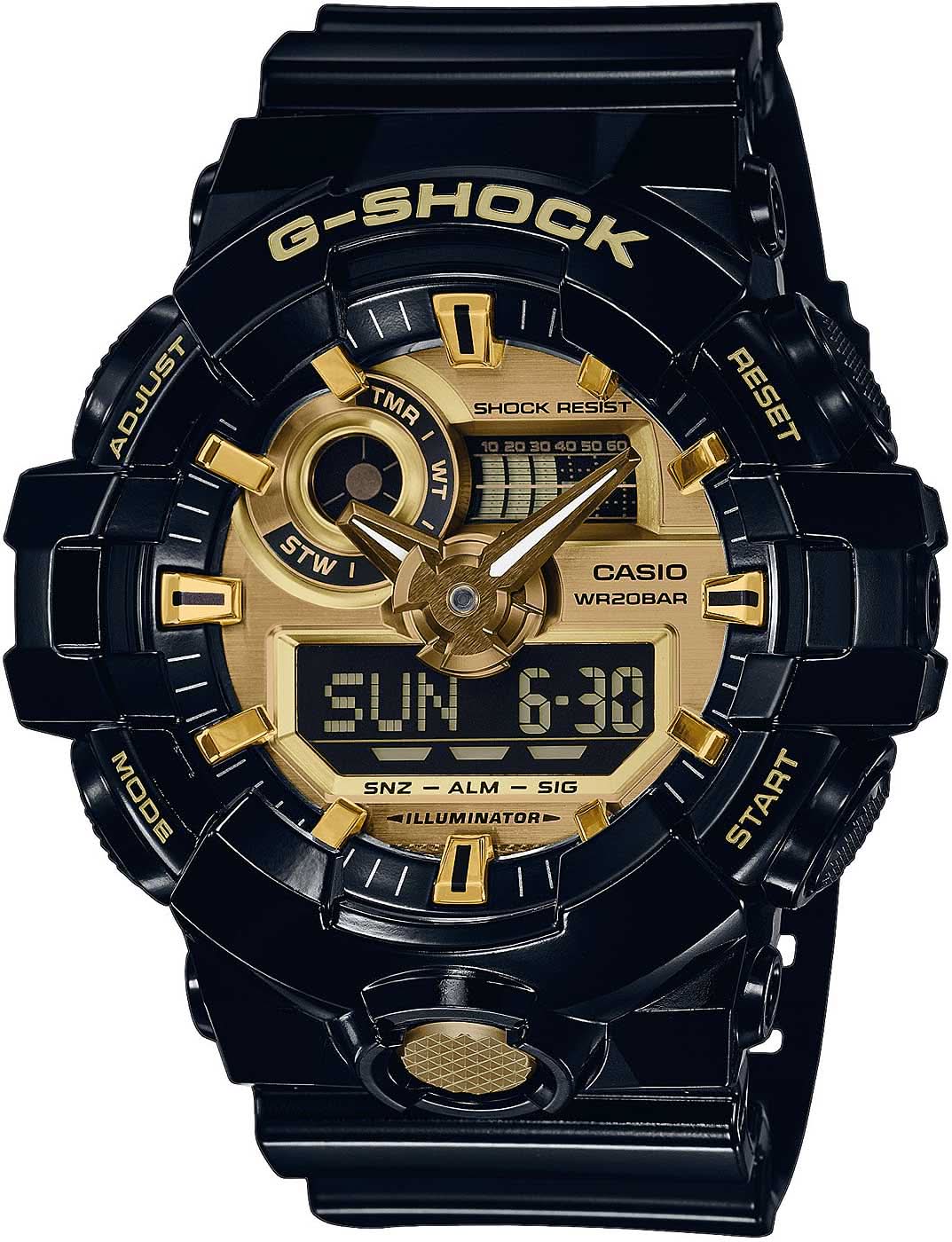 Reloj de hombre con caja negra y correa negra, detalles dorados, pantalla digital