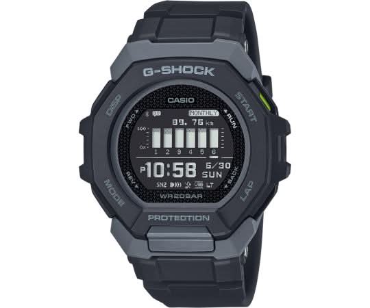 Reloj deportivo digital con caja y correa negras, pantalla redonda con hora