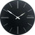 Reloj de pared redondo de plástico, oscuro con manecillas y marcas de índice blancas, logo JVD