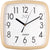 Reloj de pared JVD con marco de plástico beige, esfera blanca y manecillas negras