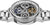 Reloj de pulsera para hombre visto desde arriba: caja plateada con varios engranajes visibles