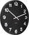 Reloj de pared negro con números y manecillas blancos y segundero rojo en corte diagonal