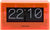 Reloj de mesa acrílico con números abatibles, carcasa naranja, pantalla 22 y 10