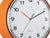 Esfera de reloj de pared con manecilla de minutos naranja, marcadores de hora negros