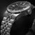 Reloj de buceo para hombre con esfera negra, manecillas luminosas y correa de acero inoxidable