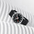 Reloj Mondaine Stop2Go con correa de cuero negra, caja redonda con esfera negra