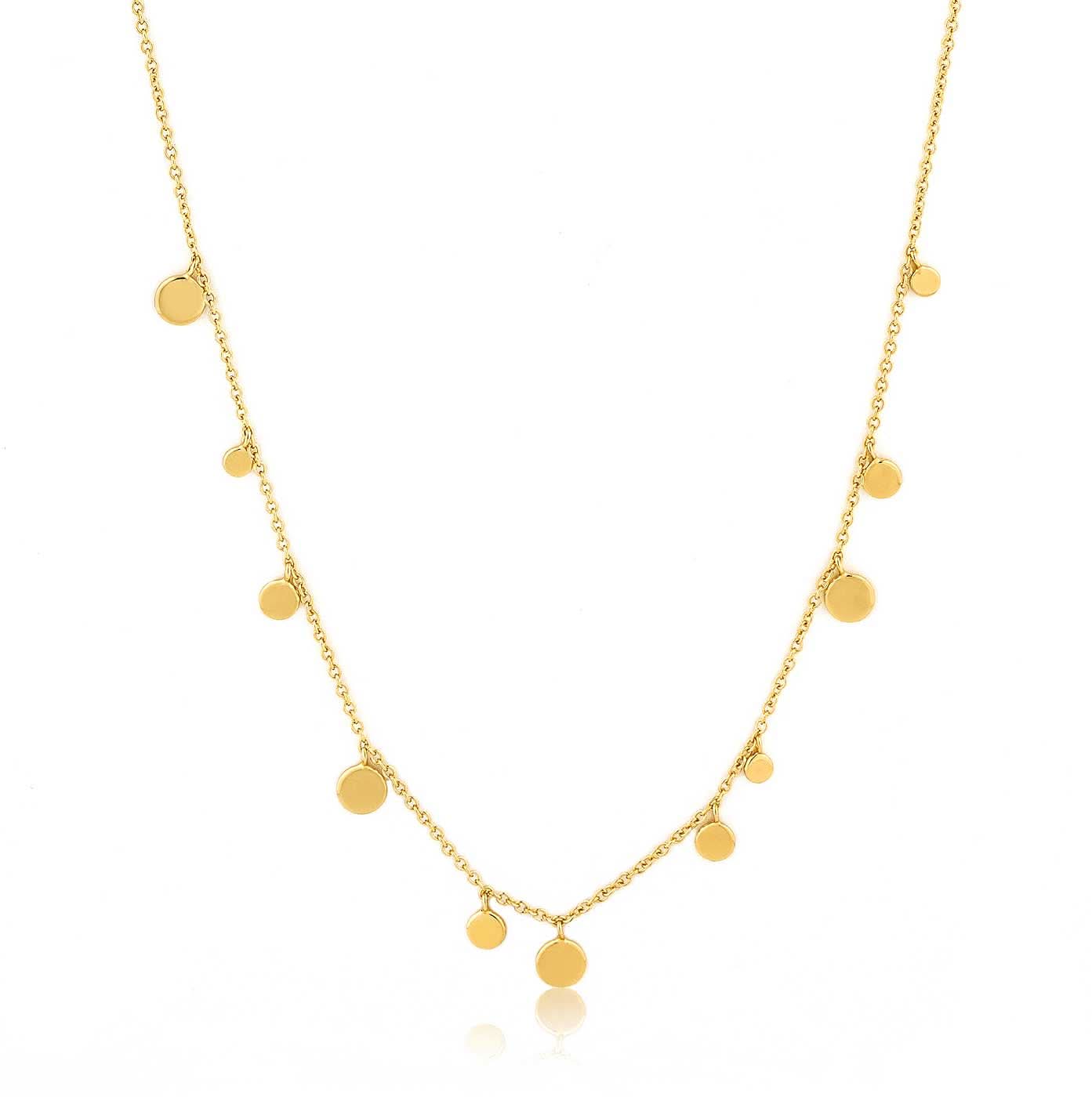 Collar dorado con pequeños discos redondos como colgante, cadena fina