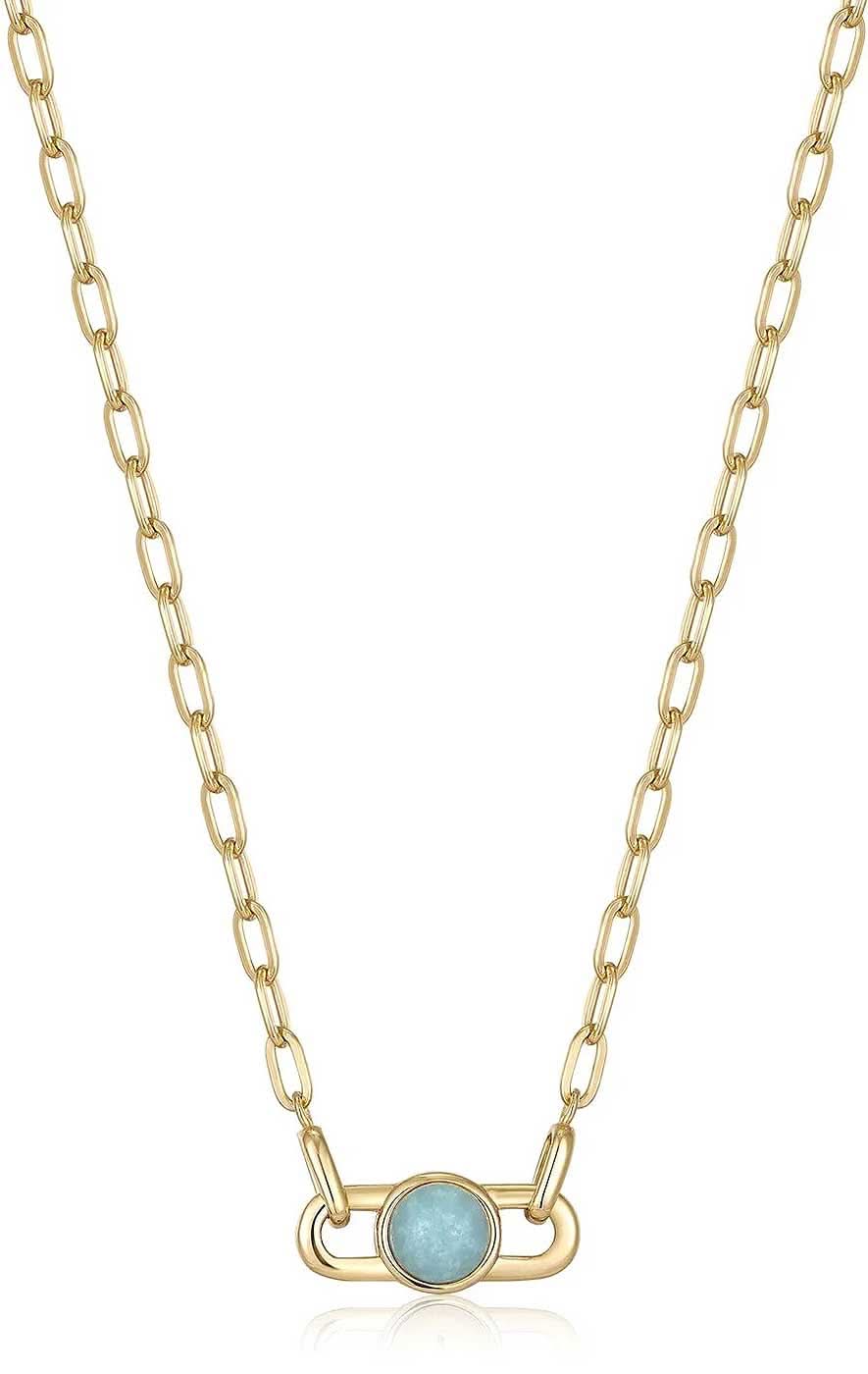 Collar dorado con colgante ovalado y piedra turquesa