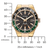 Reloj de hombre vista frontal: caja dorada, esfera negra, bisel verde