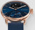 "Reloj inteligente híbrido: esfera azul, caja de oro rosa, correa azul oscuro"