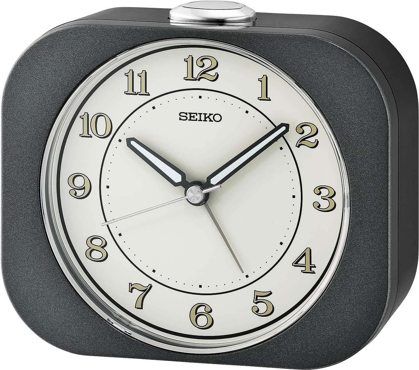 Despertador analógico Seiko con esfera redonda blanca y carcasa de plástico oscuro