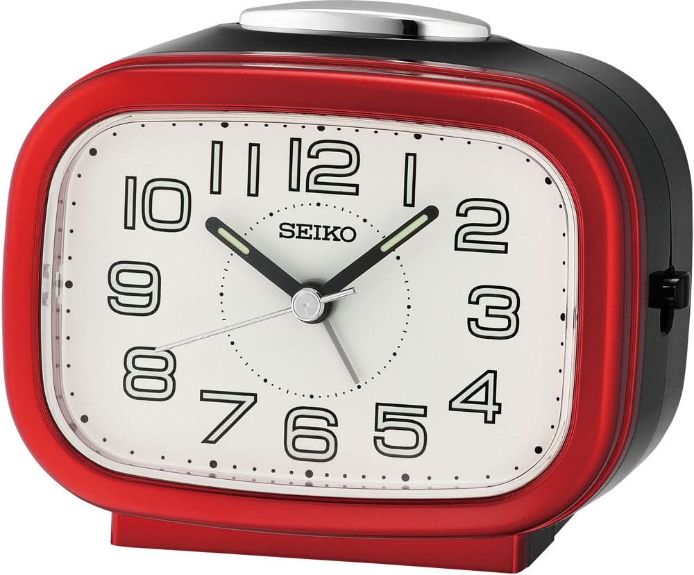 Despertador analógico Seiko con esfera blanca, manecillas negras y carcasa roja.