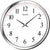 "Reloj de pared con marco redondo de metal, esfera blanca y manecillas negras"