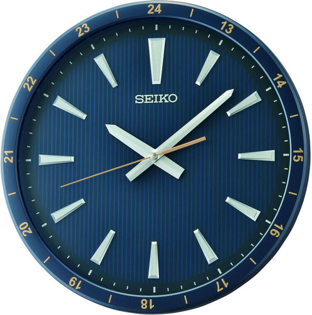 Esfera azul del reloj de pared Seiko con manecillas blancas, marcadores de índice y logotipo SEIKO
