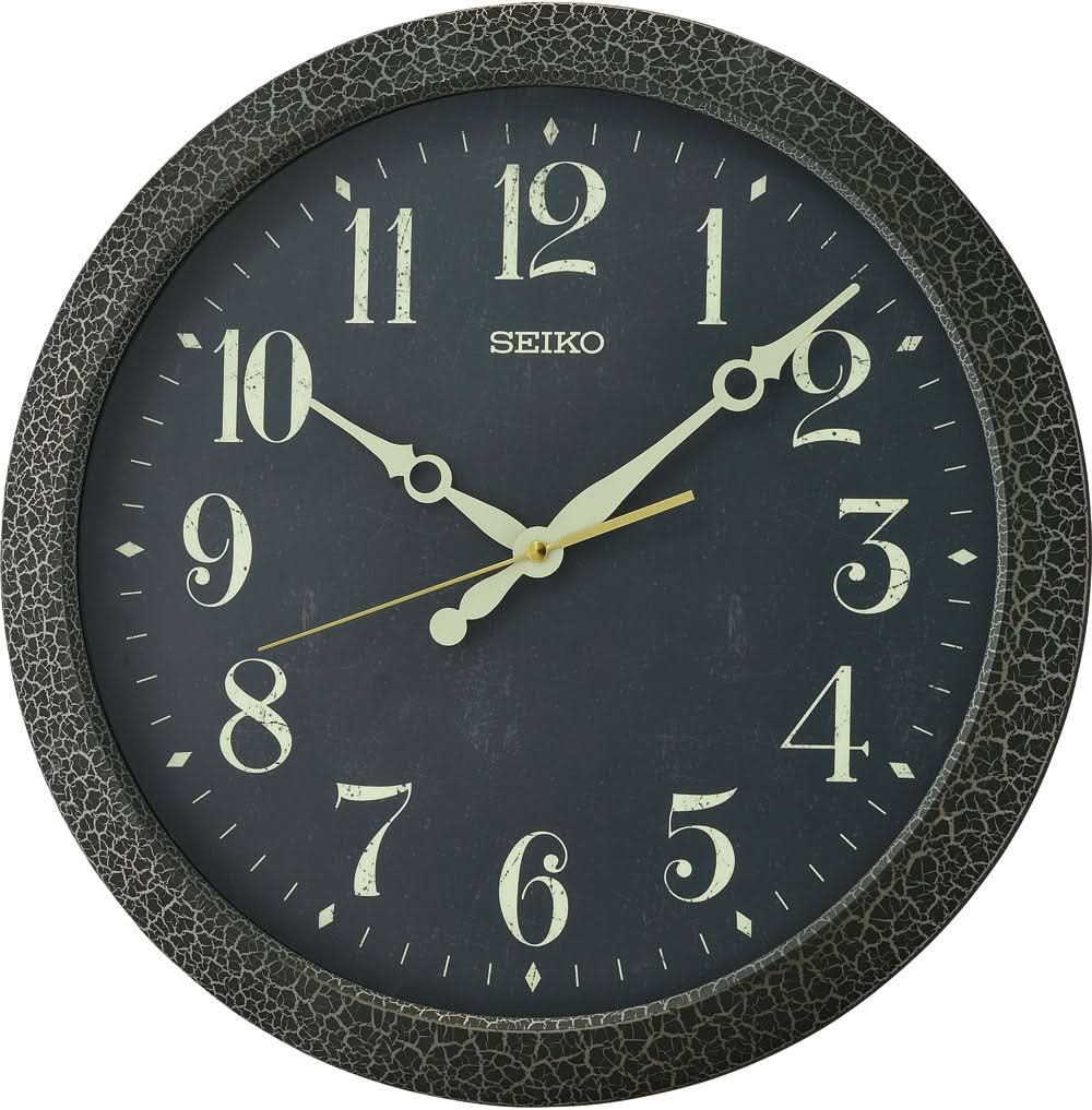 Reloj de pared Seiko, reloj de pared redondo de plástico: esfera gris oscuro, números y manecillas dorados