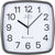 Reloj de pared con marco de plástico gris y esfera blanca, números grandes en negro, controlado por radio