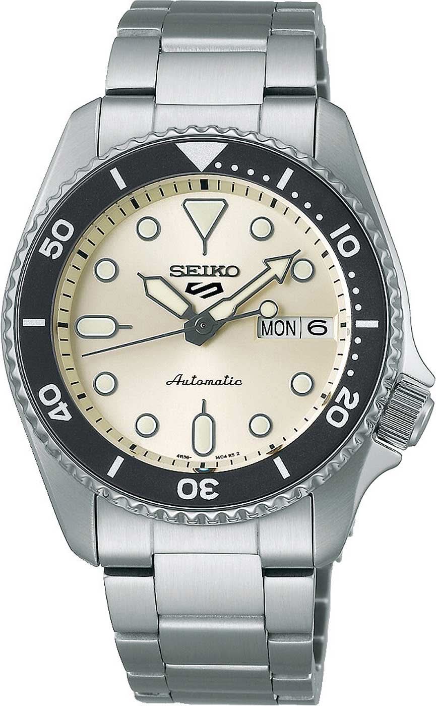 Reloj de pulsera de acero: esfera beige, bisel negro, fecha LUN 6