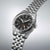 Reloj de hombre con correa de acero inoxidable y esfera negra, bisel con índices