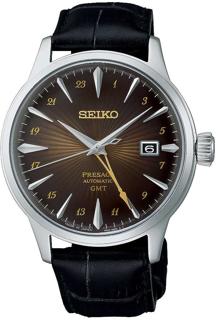 Reloj de hombre con correa de cuero negra y esfera marrón, bisel plateado