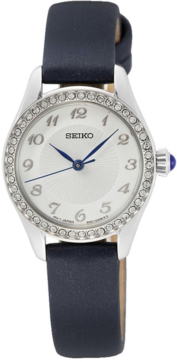 Reloj de mujer con correa de cuero azul, caja plateada, esfera blanca y bisel con pedrería